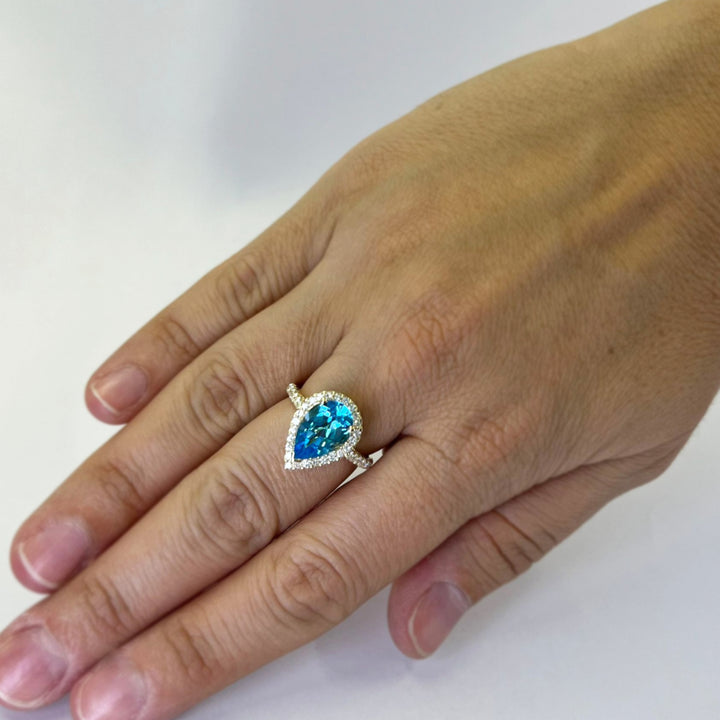 Blue Topaz and Diamond Halo Ring