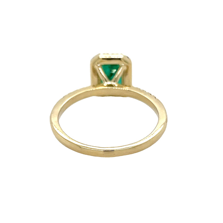 Emerald Cut Emerald and Diamond Halo Ring