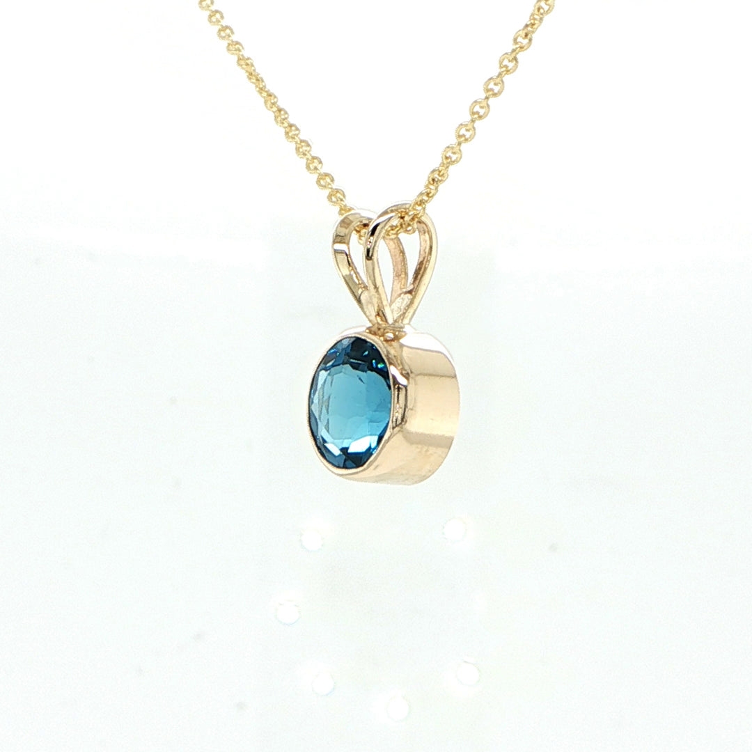 14K Yellow Gold Blue Topaz Pendant