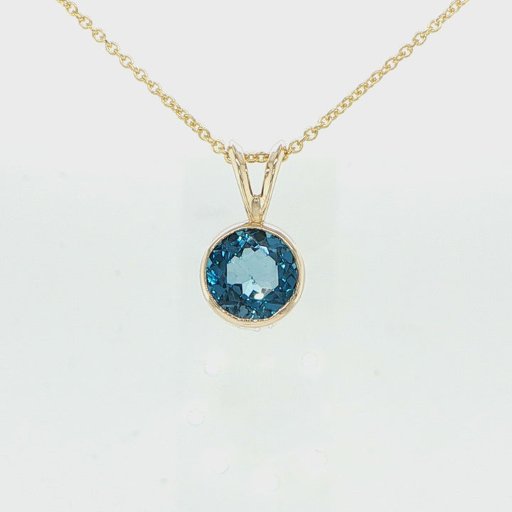 14K Yellow Gold Blue Topaz Pendant