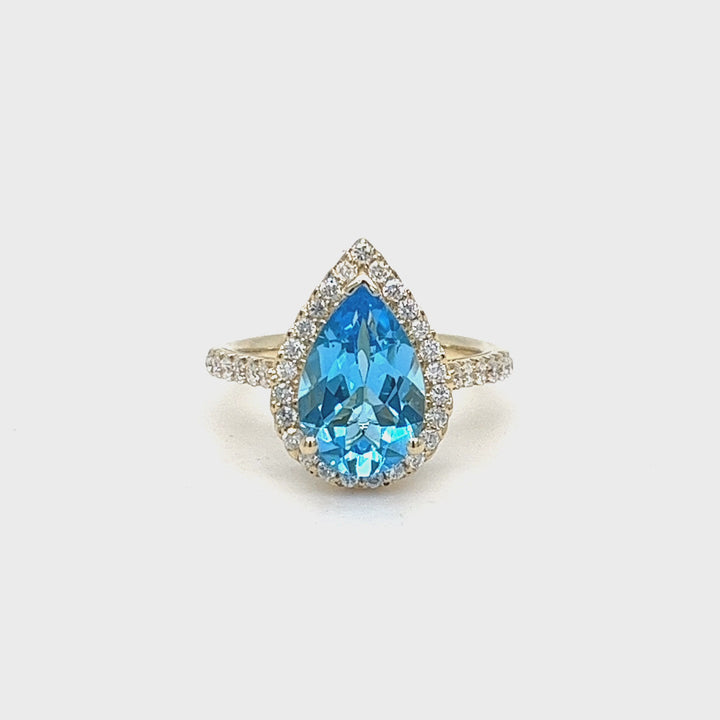 Blue Topaz and Diamond Halo Ring